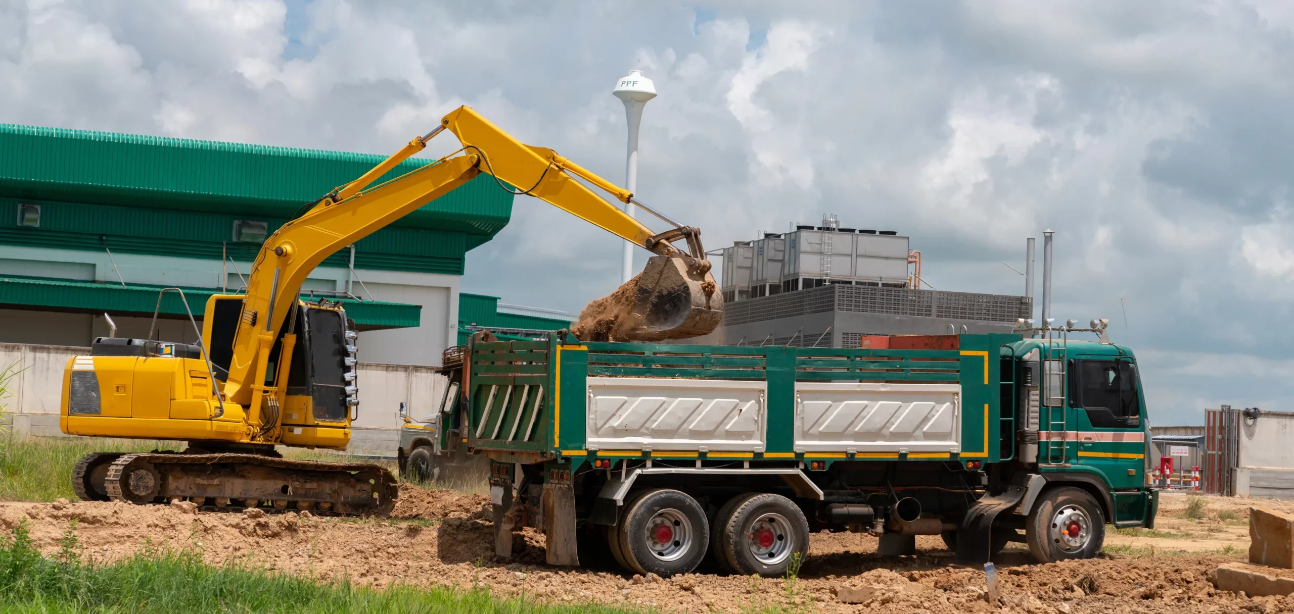 excavator-load-soil-truck-construction-site 1